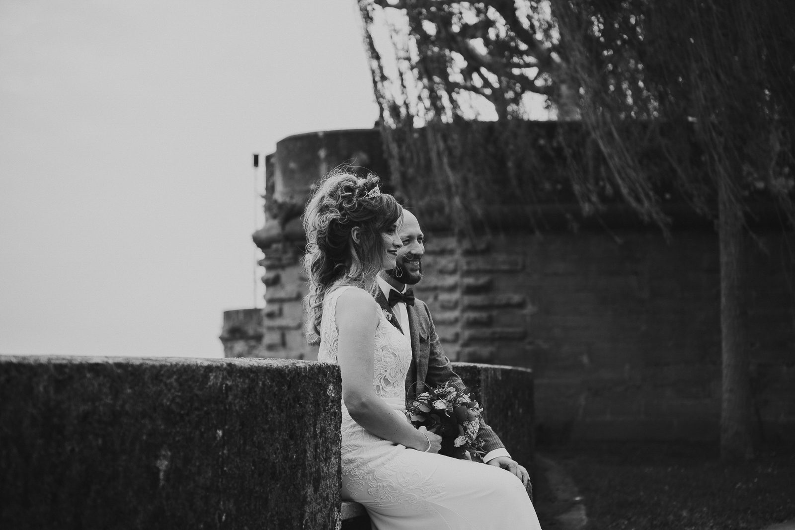 Wedding photographer castle wedding Bavaria – bridal couple on a historic castle bridge